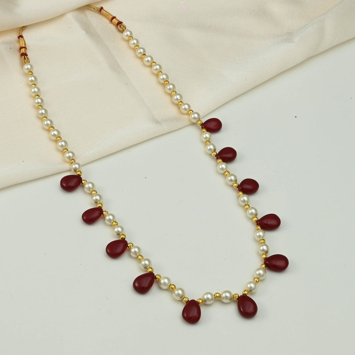 Pearl String Necklace With Drop Shaped Beads